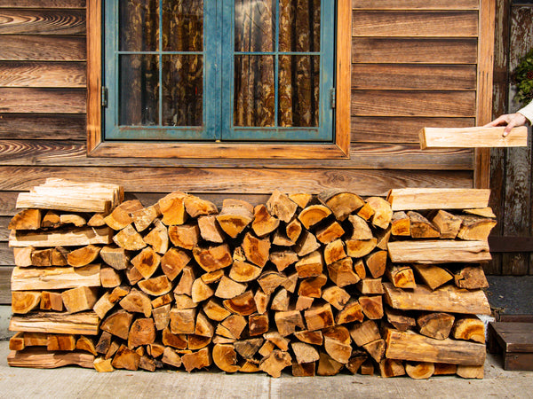True half face cord of kiln-dried firewood, neatly stacked